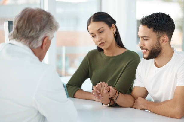 A couple talking with a healthcare professional